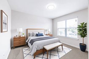 Victoria apartment for rent - A bedroom with a bed, nightstand, and window.