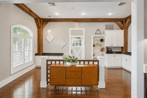 Kansas City apartment for rent - A kitchen with white cabinets and a wooden floor.