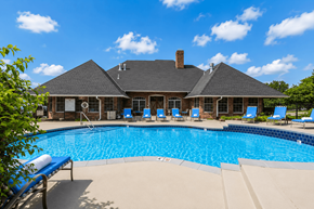 Kansas City apartment for rent - A large house with a pool in front.