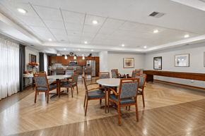 West Chanhassen apartment for rent - A dining room with a table surrounded by chairs.
