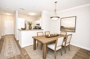 Snellville apartment for rent - A dining room with a wooden table and chairs.