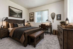 Meridian apartment for rent - Rustic bedroom with fishing themed wall decor at Silver Ridge Apartments, Meridian, 83642