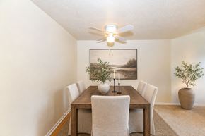 East Point townhouse for rent - Dining room with wooden table and chairs at Stonetree Apartments, East Point, Georgia