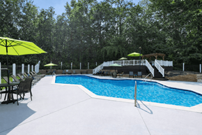 Charlottesville apartment for rent - A pool with a white fence and trees in the background.