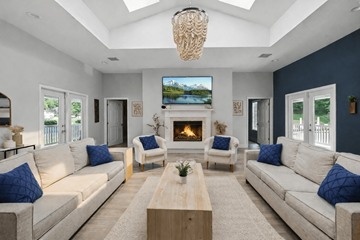 Charlottesville apartment for rent - A living room with a fireplace and a television mounted above it.
