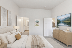Prior Lake apartment for rent - A bedroom with a large bed and a painting on the wall.