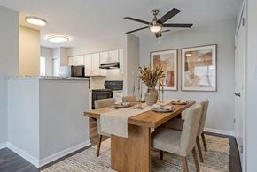 University Park apartment for rent - A dining room with a wooden table and chairs at Arbors at Hickory Creek Apartments , Illinois, 60484