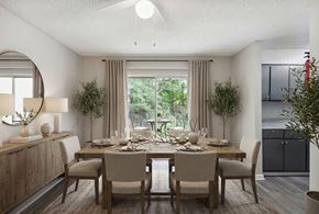 Decatur townhouse for rent - A dining room with a table set for four and a view of the backyard.