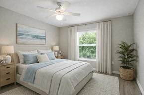 Naples apartment for rent - A bedroom with a large bed and a ceiling fan.