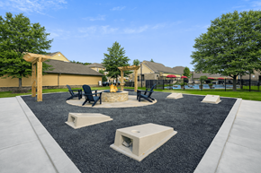 Cordova apartment for rent - A playground with a black rubber surface and concrete structures.