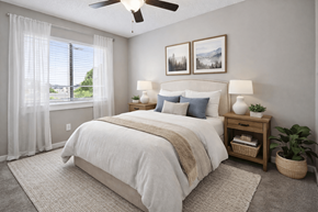 Concord apartment for rent - A bedroom with a large bed, a ceiling fan, and a window with curtains.