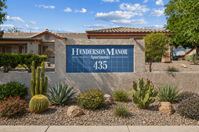 Henderson apartment for rent - A sign for Henderson Manor Apartments is displayed in front of a building.