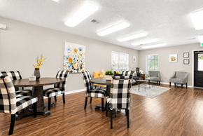 West Jordan apartment for rent - A dining room with a table set for six people.