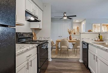 University Park apartment for rent - A kitchen with a table and chairs in the middle of it.