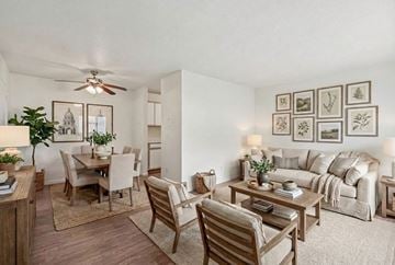 Chaska apartment for rent - A living room with a dining table and chairs.