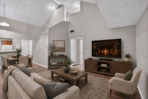 Dallas townhouse for rent - A cozy living room with a fireplace and comfortable seating.