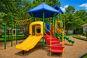 Newnan apartment for rent - A playground with a yellow slide and a blue roof.