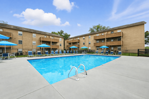 Mooresville apartment for rent - A large swimming pool in front of apartment buildings.