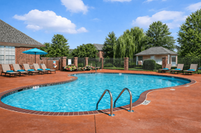 Marion apartment for rent - A pool surrounded by a brick patio and a gazebo.