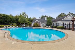 Lithonia apartment for rent - A large swimming pool in front of a house.