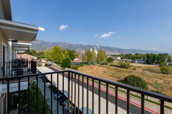 Balcony view overlooking mountains and open fields