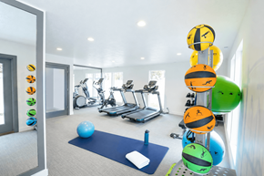 Midvale apartment for rent - A gym with a blue mat and a blue exercise ball at Creekview Apartments, Midvale, UT, 84047