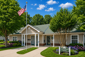 Chesterfield apartment for rent - A small building with a flag on top and a sign in front that says "Future Homes".