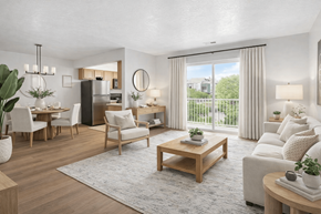 West Valley City apartment for rent - A well-lit, modern living room with a dining area and a kitchen in the background.