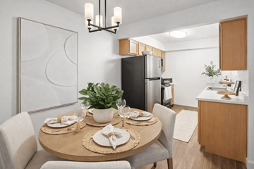 West Valley City apartment for rent - A modern dining room with a round table set for two.