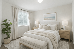 Spanish Fork apartment for rent - A bedroom with a large bed, a potted plant, and a framed picture on the wall. at Diamond Fork Apartments, Utah