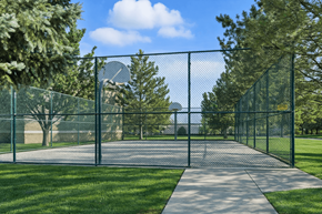 Spanish Fork apartment for rent - A fenced pathway in a park with trees on either side. at Diamond Fork Apartments, Spanish Fork, Utah
