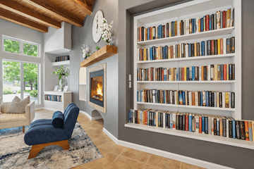 Sante Fe apartment for rent - A living room with a fireplace and a bookshelf filled with books.