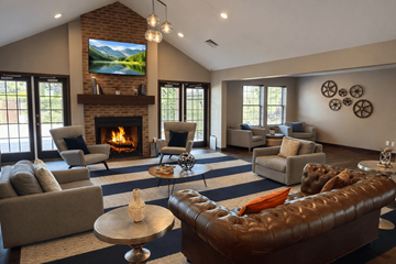 Burnsville apartment for rent - A living room with a fireplace and a television mounted above it.