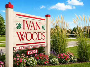 Lansing apartment for rent - A sign for Ivan Woods Senior Community with a red and green design on the top left.