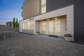 Richland apartment for rent - Clubhouse entrance with patio seating area at Lofts at Innovation Center Apartments, Richland, WA