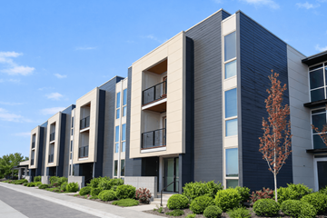 Richland apartment for rent - A modern apartment building with balconies and a clear blue sky.