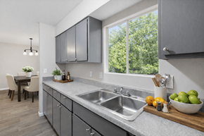 Decatur townhouse for rent - A modern kitchen with a large window and a dining table.