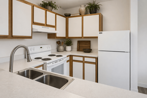 Brigham City apartment for rent - A kitchen with white appliances and wooden cabinets.