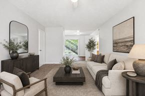Riverdale apartment for rent - Living room with modern furniture and neutral decor at Stratford Arms Apartments, Riverdale