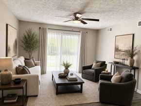 Louisville apartment for rent - Modern living room with large windows at Tanyard Park Apartments, Louisville