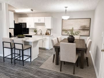 Louisville apartment for rent - A kitchen with a dining table and chairs.