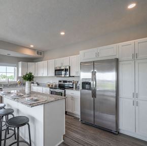 Falcon Heights apartment for rent - Modern kitchen with white cabinetry and granite countertops at The Hendrickson Apartments, Minnesota, 55113