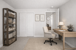 Layton apartment for rent - A room with a desk, chair, and shelf.