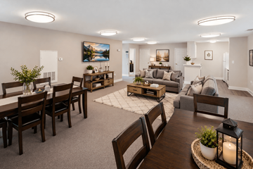 Chesterfield apartment for rent - A well-lit living room with a dining table and chairs.