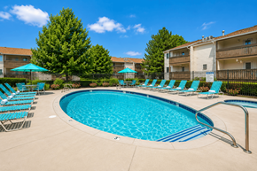 West Bountiful apartment for rent - A swimming pool surrounded by chairs and trees.