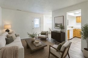 West Bountiful apartment for rent - A living room with a couch, chair, and coffee table.