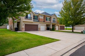 Heber City townhouse for rent - Two-story townhomes with a garage and a driveway.