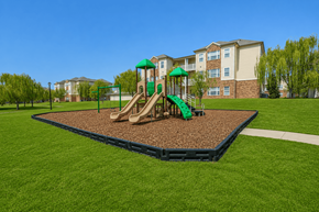 Cordova apartment for rent - A playground with a green slide and brown sandbox in the foreground.