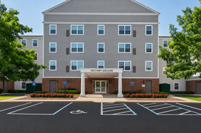 Portsmouth apartment for rent - A large building with the words "Victory Square" on the front.