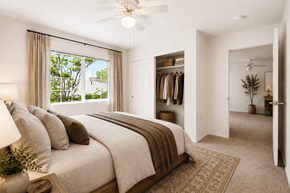 Sante Fe apartment for rent - A bedroom with a large bed and a ceiling fan.